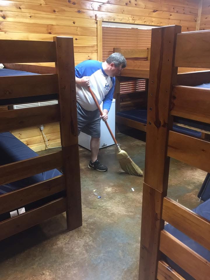 Coach Clay helping clean after an HC event