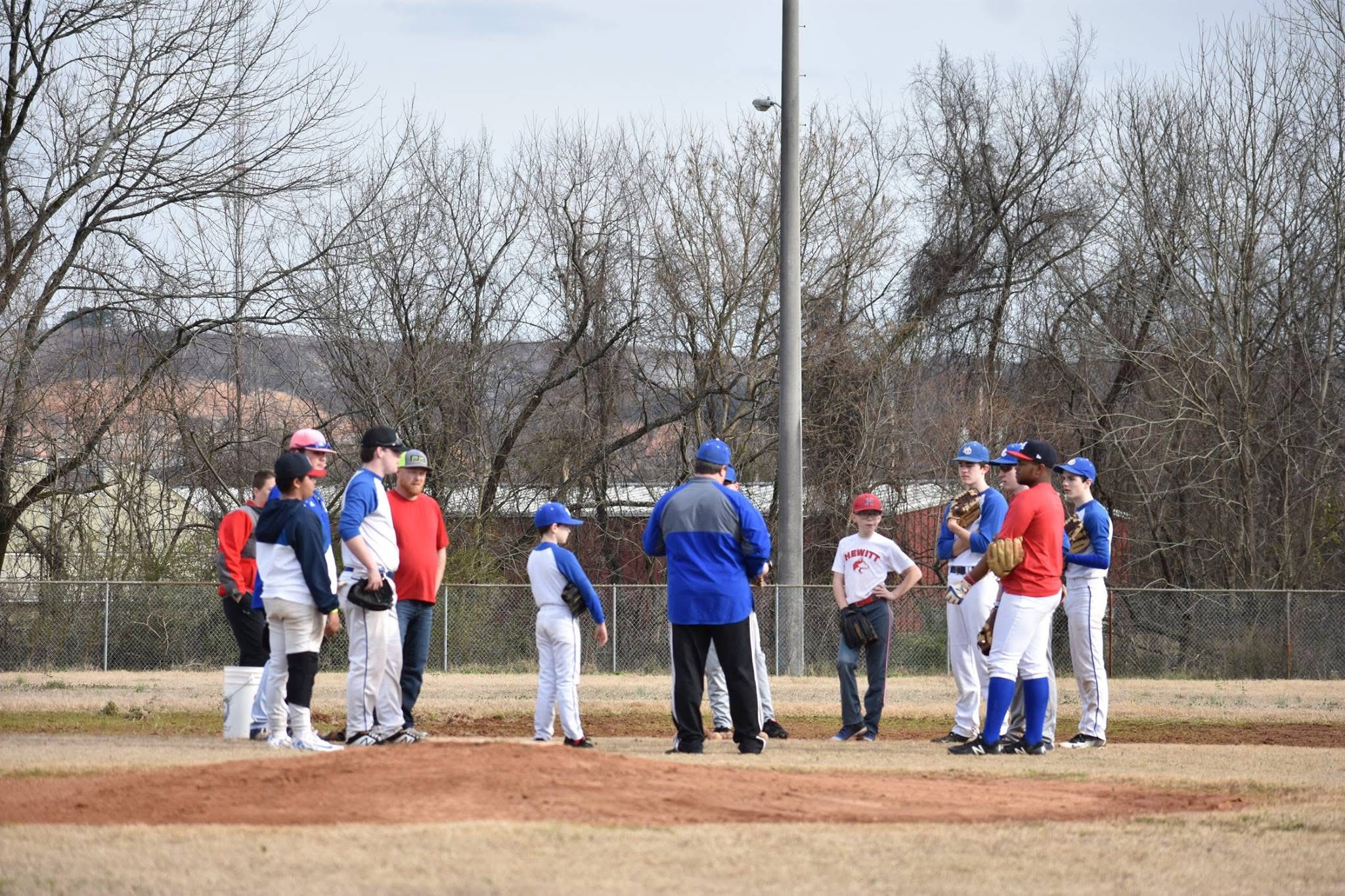 Coach Clay teaching and coaching on the field