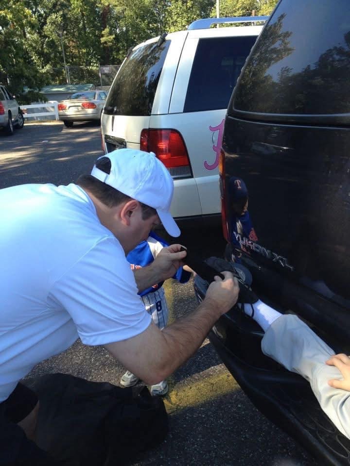 Coach Clay duct taping baseball cleats