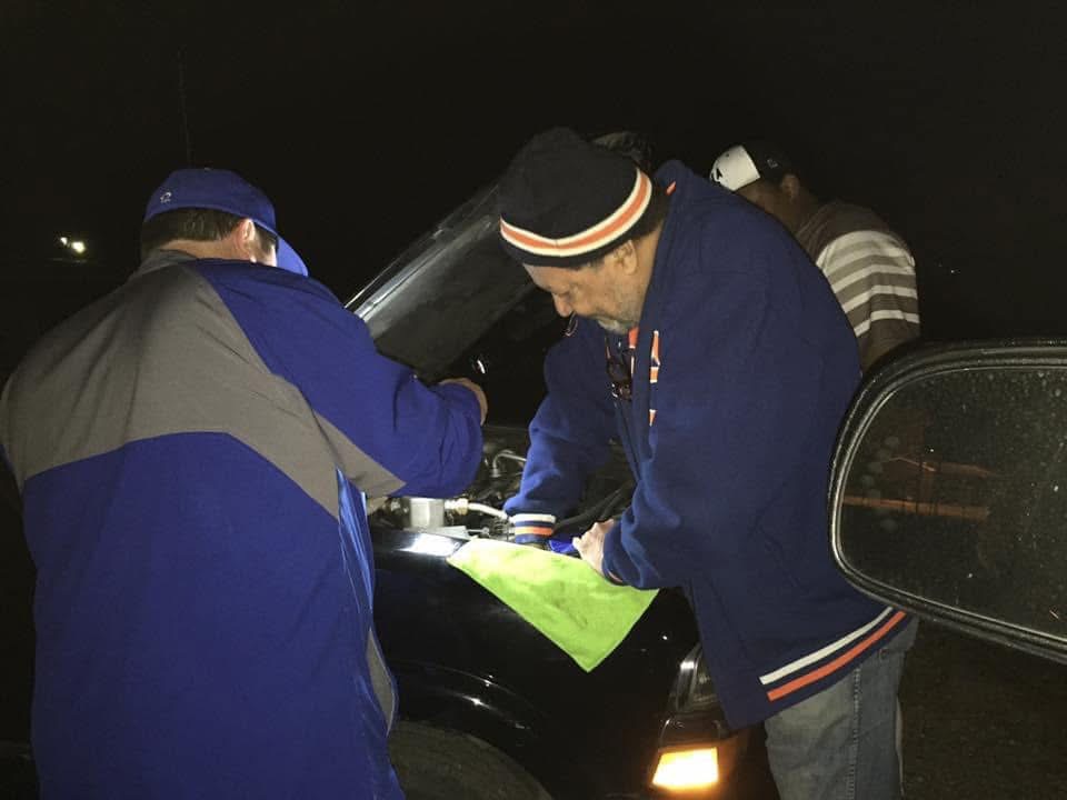 Coach Clay helping an opponent after a baseball game
