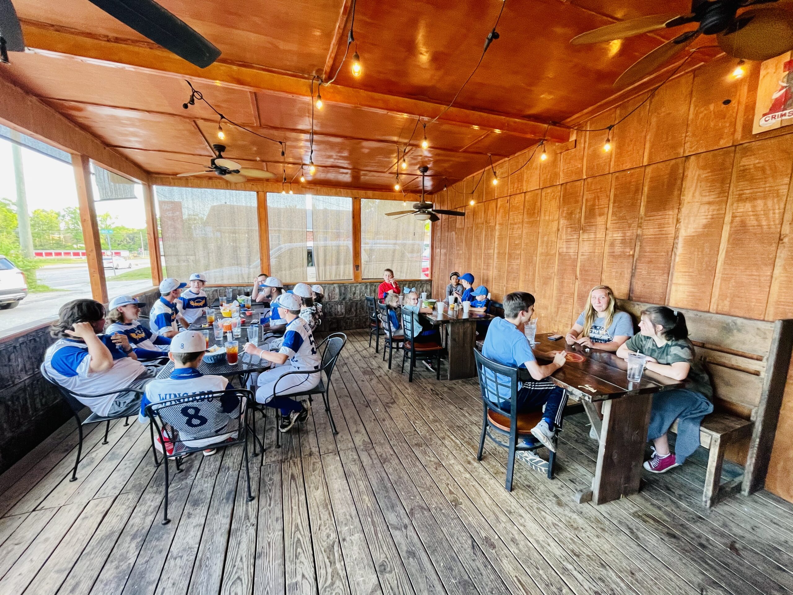 HC families and athletes gathered around tables during a retreat