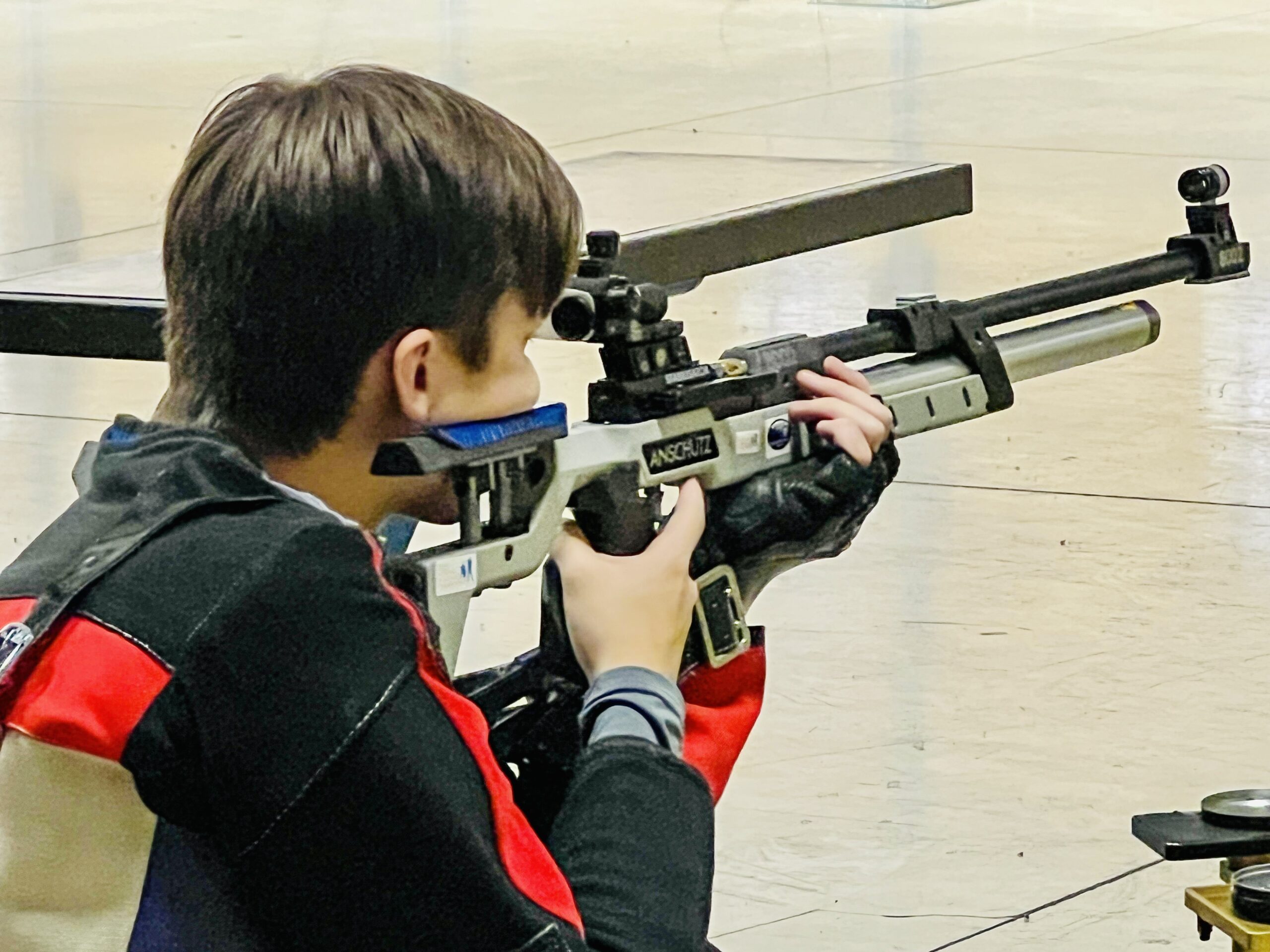 Close-up of a Heritage Christian rifle athlete on the firing line